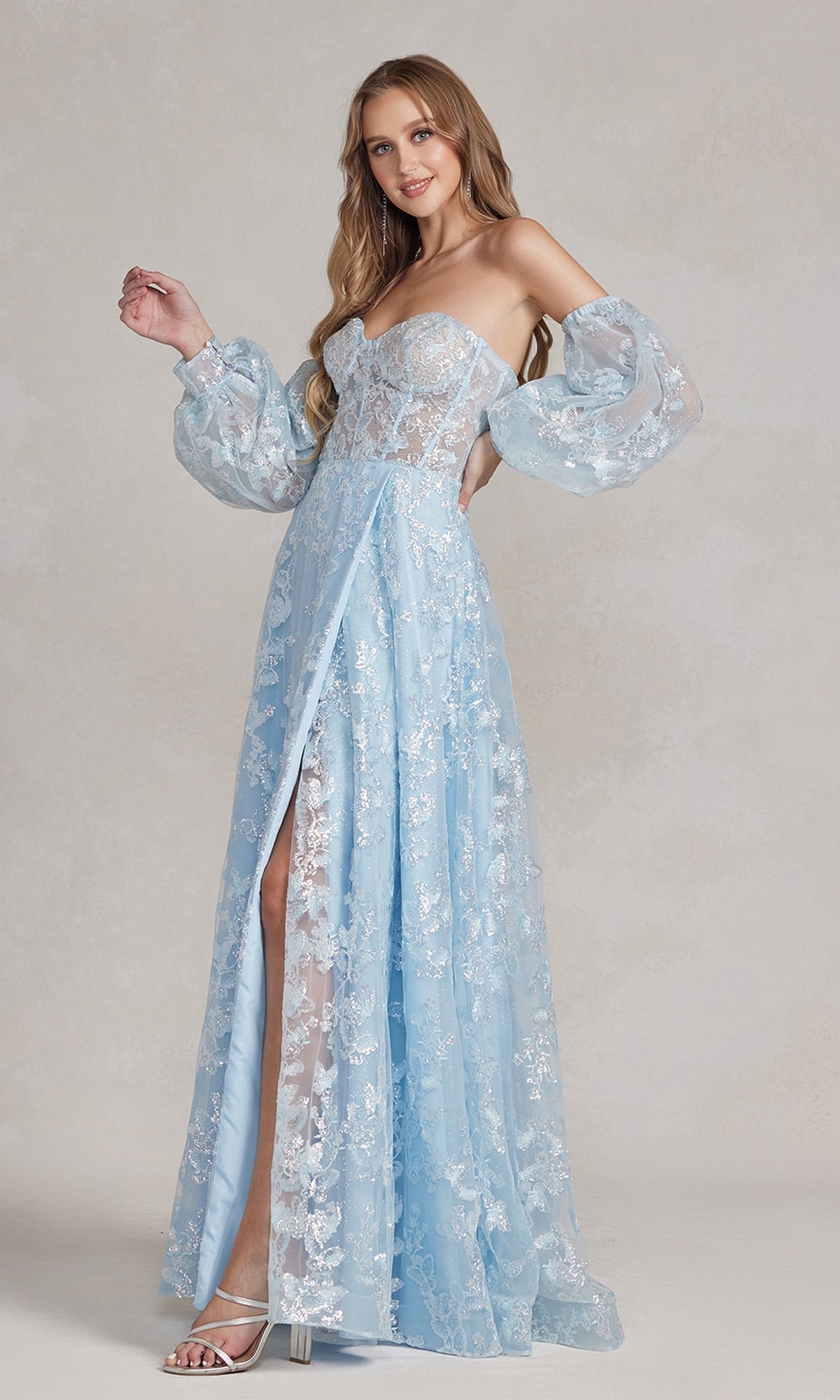 A woman in a Long Puff-Sleeve Prom Dress with a sheer bodice stands against a neutral background.
